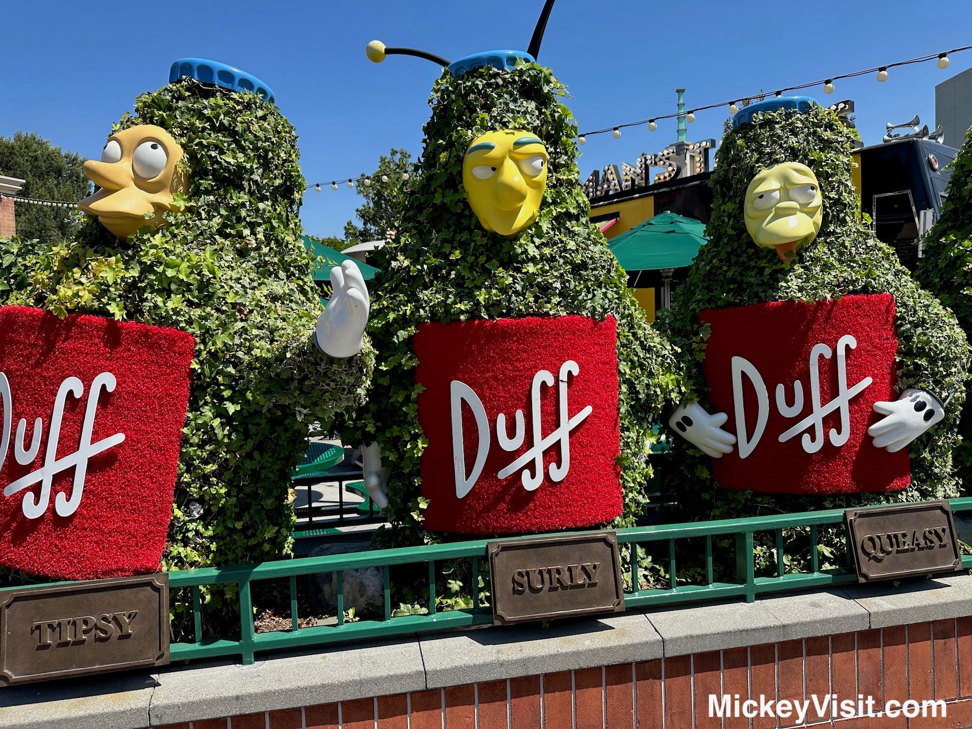 Simpsons land beer can statues