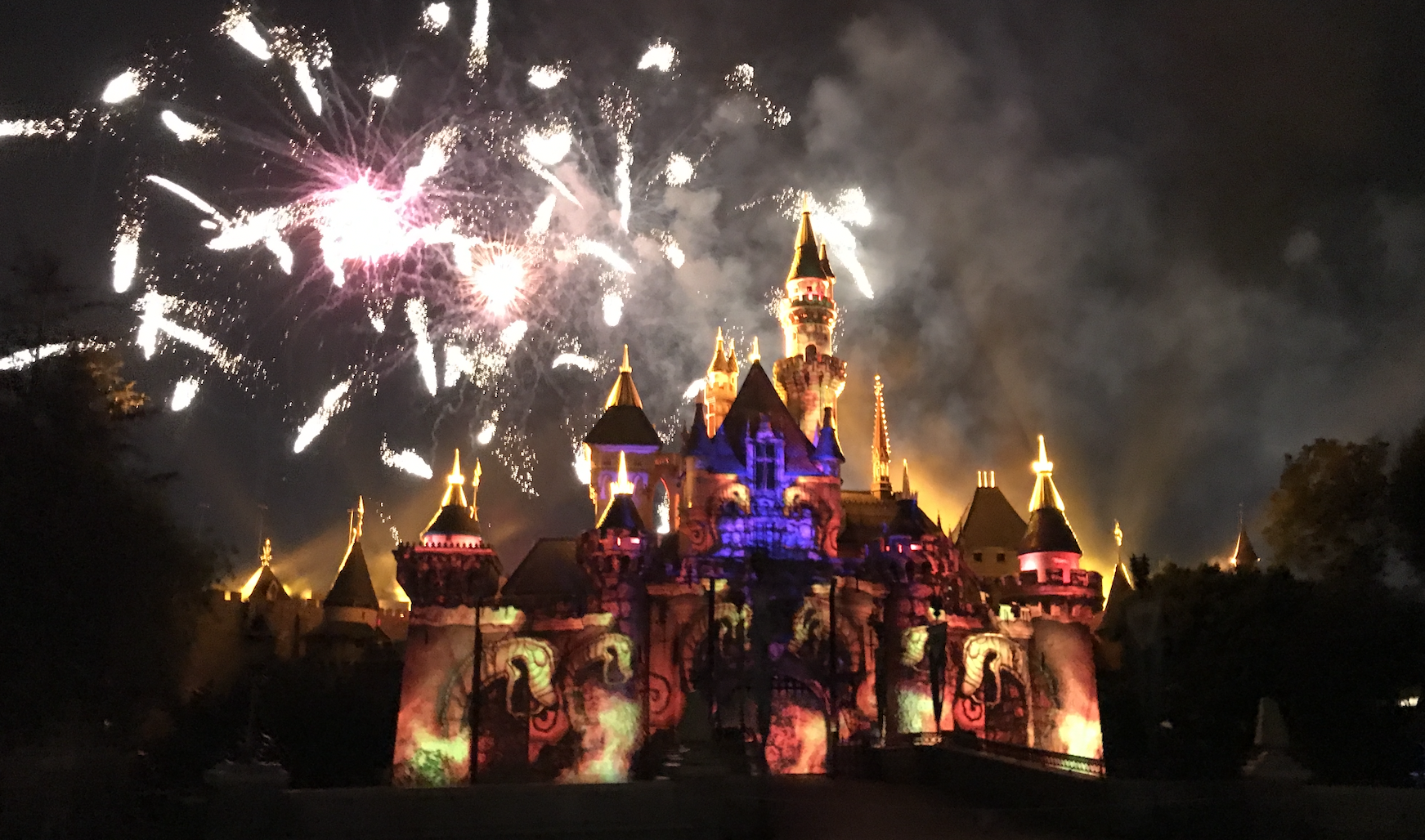 Fireworks in front of Disneyland castle- Disneyland planning guide